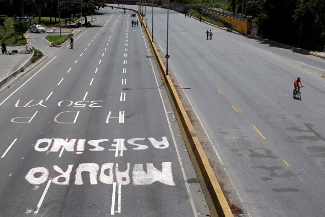 A graffiti that reads "Murderer Maduro" is seen on a highway during a strike called to protest against Venezuelan President Nicolas Maduro's government in Caracas, Venezuela July 26, 2017. REUTERS/Andres Martinez Casares