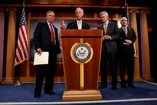 Senator Ron Johnson (R-WI), accompanied by Senator Lindsey Graham (R-SC), Senator Bill Cassidy (R-LA) and Senator John McCain (R-AZ), speaks during a press conference about their resistance to the so-called "Skinny Repeal" of the Affordable Care Act on Capitol Hill in Washington, U.S., July 27, 2017. REUTERS/Aaron P. Bernstein     TPX IMAGES OF THE DAY