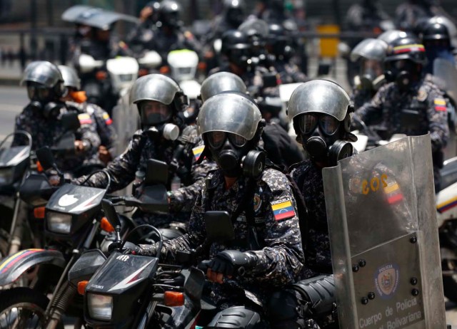 Police on motorcycles patrol as the Constituent Assembly election was being carried out in Caracas, Venezuela, July 30, 2017. REUTERS/Carlos Garcia Rawlins