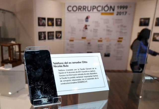 A seized cellphone belonging to former senator Otto Bula involved in the Brazilian constructionr giant Odebrecht scandal is on display during the opening of Colombia's General Prosecutor's Office museum in Bogota, on July 7, 2017. The museum was inaugurated within the framework of the 25th anniversary of the General Prosecutor's Office and aims to bring to the public to objects seized in judicial processes in the country. / AFP PHOTO / Raul Arboleda