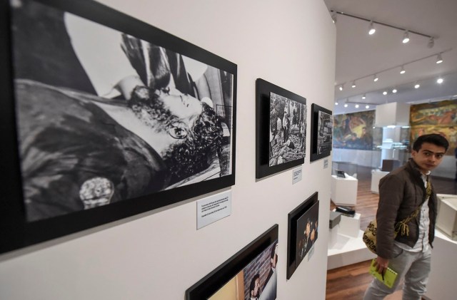 Pictures of lata drug lord Pablo Escobar and other drug traffickers are on displayn during the opening of Colombia's General Prosecutor's Office museum in Bogota, on July 7, 2017. The museum was inaugurated within the framework of the 25th anniversary of the General Prosecutor's Office and aims to bring to the public to objects seized in judicial processes in the country. / AFP PHOTO / Raul Arboleda