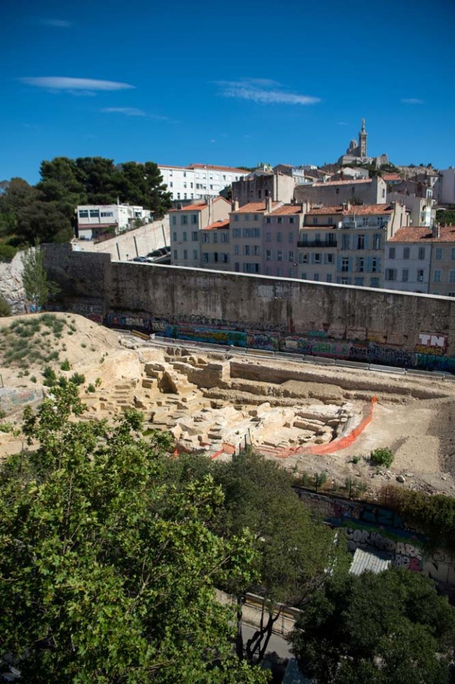 A picture taken on July 28, 2017 in Marseille, southern France, shows the area of a Ancient Greek quarry set to be classified as a historical monument after the mobilization of local residents. / AFP PHOTO / BERTRAND LANGLOIS