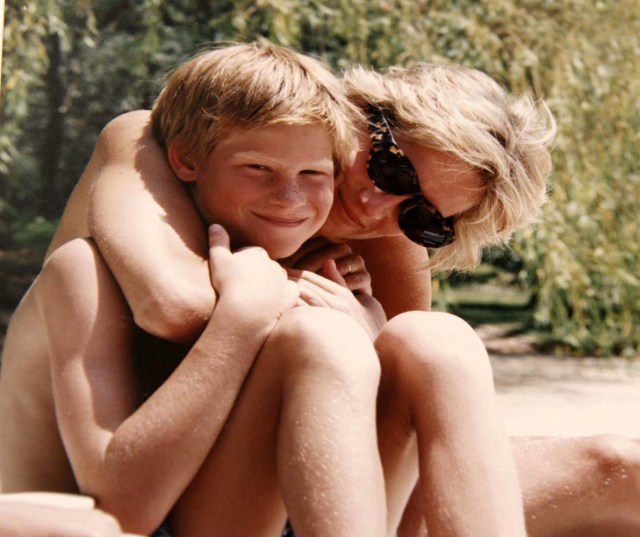 Britain's Prince Harry and the late Diana, Princess of Wales are seen in an undated photo released by Kensington Palace on July 23, 2017. The image taken from the personal photo album of the late Diana, Princess of Wales, shows the princess and Prince Harry on holiday and features in the new ITV documentary 'Diana, Our Mother: Her Life and Legacy', which airs on ITV at 21.00hrs on July 24, 2017. Kensington Palace/Pool/ Handout via REUTERS ATTENTION EDITORS - THIS IMAGE WAS PROVIDED BY A THIRD PARTY. NO RESALES. NO ARCHIVES. NOT FOR SALE FOR MARKETING OR ADVERTISING CAMPAIGNS. NO USE AFTER MONDAY JULY 31, 2017. NEWS EDITORIAL USE ONLY. NO USE ON THE FRONT COVERS OF ANY UK OR INTERNATIONAL MAGAZINES. NO COMMERCIAL USE (INCLUDING ANY USE IN MERCHANDISING, ADVERTISING OR ANY OTHER NON-EDITORIAL USE INCLUDING, FOR EXAMPLE, CALENDARS, BOOKS AND SUPPLEMENTS). THIS PHOTOGRAPH (WHOSE COPYRIGHT IS VESTED IN THE DUKE OF CAMBRIDGE AND PRINCE HARRY) IS PROVIDED TO YOU ON CONDITION THAT YOU WILL MAKE NO CHARGE FOR THE SUPPLY, RELEASE OR PUBLICATION OF IT AND THAT THESE CONDITIONS AND RESTRICTIONS WILL APPLY (AND THAT YOU WILL PASS THESE ON) TO ANY ORGANISATION TO WHOM YOU SUPPLY IT. ALL OTHER REQUESTS FOR USE SHOULD BE DIRECTED TO THE PRESS OFFICE AT KENSINGTON PALACE IN WRITING.