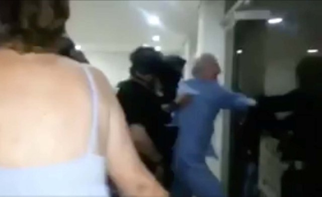 A still image taken from a social media video said to show the moment in which former Caracas Mayor Antonio Ledezma (in blue) is led under arrest from his home, in Caracas, Venezuela August 1, 2017. Social Media/Handout via REUTERS ATTENTION EDITORS - THIS IMAGE HAS BEEN SUPPLIED BY A THIRD PARTY. NO RESALES. NO ARCHIVES