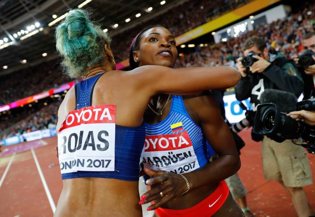 Athletics - World Athletics Championships – women’s triple jump final – London Stadium, London, Britain – August 7, 2017 – Yulimar Rojas of Venezuela and Caterine Ibarguen of Colombia react after the final. REUTERS/Kai Pfaffenbach