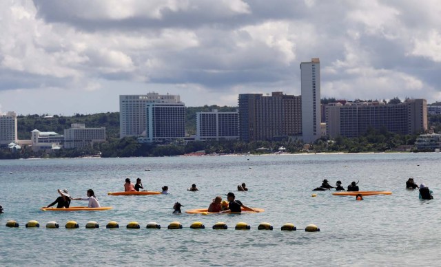Tourists are pictured on the waters off Tumon beach on the island of Guam, a U.S. Pacific Territory, August 11, 2017. REUTERS/Erik De Castro