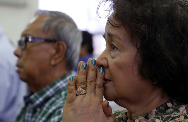 Local residents pray during a Sunday mass at Sta Barbara Church on the island of Guam, a U.S. Pacific Territory, August 13, 2017.  REUTERS/Erik De Castro