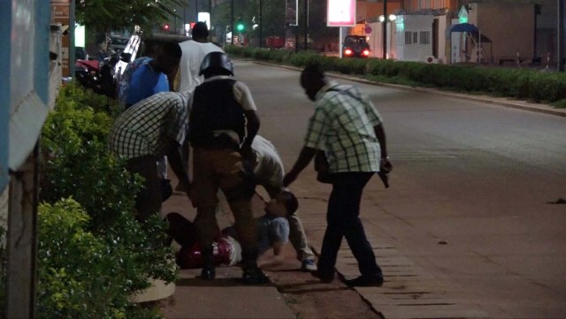 REFILE - QUALITY REPEAT A wounded unidentified person is evacuated following an attack by gunmen on a restaurant in Ouagadougou, Burkina Faso, in this still frame taken from video August 13, 2017. REUTERS/Reuters TV TPX IMAGES OF THE DAY
