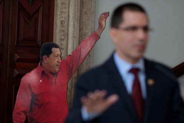 Venezuela's Foreign Minister Jorge Arreaza talks to the media in front of a cardboard cut-out of Venezuela's late President Hugo Chavez, during a news conference in Caracas, Venezuela August 16, 2017. REUTERS/Marco Bello