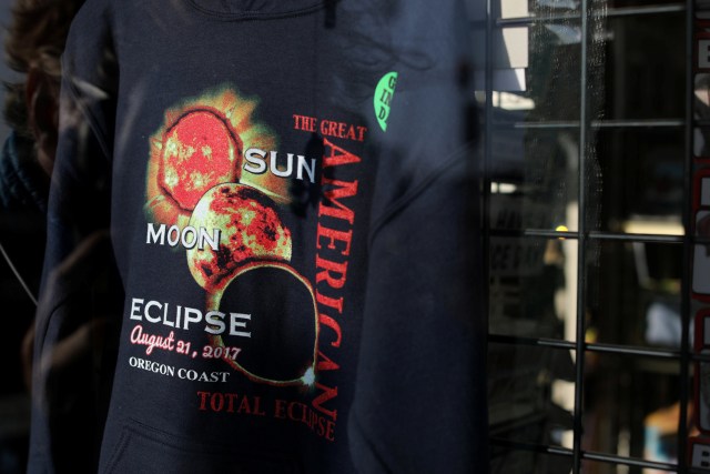 Eclipse T-shirts are shown for sale in store windows as the small town of Depoe Bay, Oregon, U.S., prepares for the coming solar eclipse,  August 19, 2017.        REUTERS/Mike Blake NO RESALES. NO ARCHIVE.