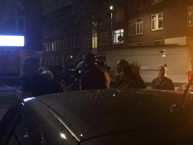 People gather at the scene where police are investigating a van (not pictured) with Spanish licence plates containing gas bottles that was found near a concert hall in Rotterdam, in this handout picture obtained by Reuters August 23, 2017. Social Media/Handout via REUTERS   ATTENTION EDITORS - THIS IMAGE HAS BEEN SUPPLIED BY A THIRD PARTY. NO RESALES. NO ARCHIVE.
