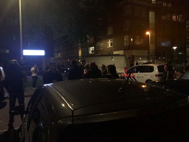 People gather at the scene where police are investigating a van with Spanish licence plates containing gas canisters which was found near a Rotterdam venue where a rock concert was cancelled, in this handout picture obtained by Reuters August 23, 2017. Social Media/Handout via REUTERS   ATTENTION EDITORS - THIS IMAGE HAS BEEN SUPPLIED BY A THIRD PARTY. NO RESALES. NO ARCHIVE.