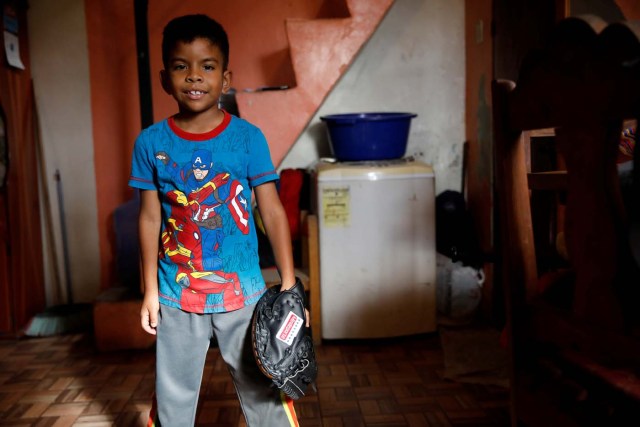 Jesus Cordova (7), poses for a picture in his house in Caracas, Venezuela August 29, 2017. Picture taken August 29, 2017. REUTERS/Carlos Garcia Rawlins