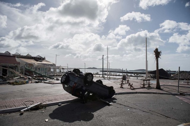 The Fort Louis Marina in Marigot is seen on September 8, 2017 in Saint-Martin island, devastated by Hurricane Irma. Officials on the island of Guadeloupe, where French aid efforts are being coordinated, suspended boat crossings to the hardest-hit territories of St. Martin and St. Barts where 11 people have died. Two days after Hurricane Irma swept over the eastern Caribbean, killing at least 17 people and devastating thousands of homes, some islands braced for a second battering from Hurricane Jose this weekend. / AFP PHOTO / Martin BUREAU