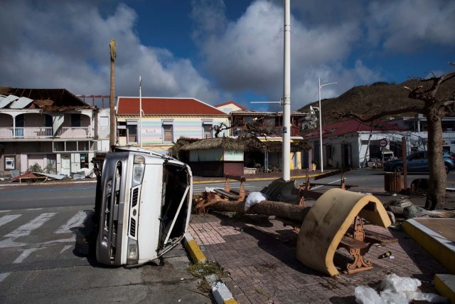 The Fort Louis Marina in Marigot is seen on September 8, 2017 in Saint-Martin island, devastated by Hurricane Irma. Officials on the island of Guadeloupe, where French aid efforts are being coordinated, suspended boat crossings to the hardest-hit territories of St. Martin and St. Barts where 11 people have died. Two days after Hurricane Irma swept over the eastern Caribbean, killing at least 17 people and devastating thousands of homes, some islands braced for a second battering from Hurricane Jose this weekend. / AFP PHOTO / Martin BUREAU