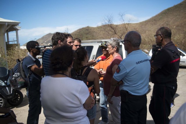 Prefect of Saint Martin Anne Laubies (C) speaks to journalists concerning the orange alert level for incoming Hurricane Jose on September 8, 2017 in Grand-Case, on the French Caribbean island of Saint-Martin, following devastation created by Hurricane Irma. Hurricane Irma killed two people and wounded 43 others when it barrelled through the Dutch part of the Caribbean island of Saint Martin, a Dutch official said September 8. Interior Minister Ronald Plasterk said he did not have any details about the people involved, but told reporters "there are two dead and 43 wounded", eleven of them seriously, after the storm pummelled the island on September 6. / AFP PHOTO / Lionel CHAMOISEAU