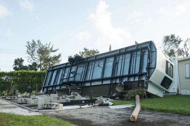 An overturned trailer is seen at the Enchanted Shores manufactured home park in Naples, Florida, on September 11, 2017 after Hurricane Irma hit Florida. / AFP PHOTO / NICHOLAS KAMM