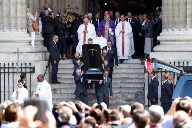Pallbearers carry the coffin of late actress Mireille Darc after her funeral ceremony at the Saint-Sulpice church in Paris, France, September 1, 2017. REUTERS/Charles Platiau