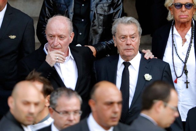 French actor Alain Delon (R) and Pascal Desprez (L), the husband of late actress Mireille Darc, attend the funeral ceremony of late actress Mireille Darc at the Saint-Sulpice church in Paris, France, September 1, 2017. REUTERS/Charles Platiau