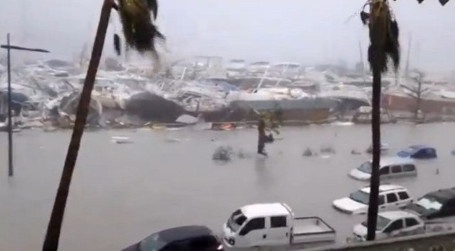 General view of half-submerged vehicles, boats and debris in the flooded harbour as Hurricane Irma  hits the French island territory of Saint Martin September 6, 2017, in this video grab made from footage taken from social media.  Mandatory credit RCI GUADELOUPE/Handout via REUTERS   ATTENTION EDITORS - THIS IMAGE HAS BEEN SUPPLIED BY A THIRD PARTY. NO RESALES. NO ARCHIVE. REUTERS IS UNABLE TO INDEPENDENTLY VERIFY THE AUTHENTICITY, CONTENT, LOCATION OR DATE OF THIS IMAGE.