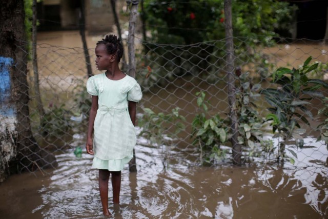 A girl stands in a flooded area after hurricane Irma in Fort Liberte, Haiti September 8, 2017. REUTERS/Andres Martinez Casares