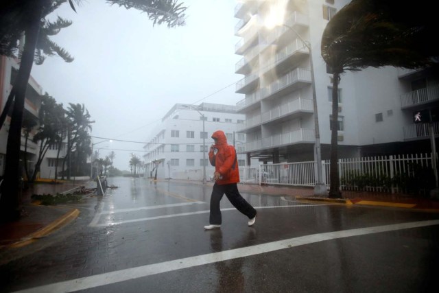 Man walks along a street in South Beach as Hurricane Irma arrives at south Florida, in Miami Beach, Florida, U.S., September 10, 2017. REUTERS/Carlos Barria