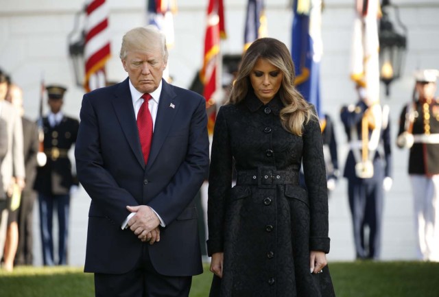 U.S. President Donald Trump and first lady Melania Trump lead a moment of silence to mark the 16th anniversary of the September 11 attacks at the White House in Washington, U.S., September 11, 2017. REUTERS/Kevin Lamarque