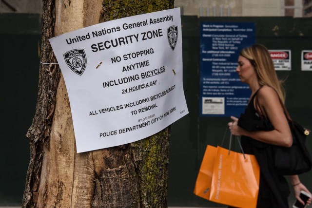 A pedestrian passes a sign announcing a security zone as the New York City police department heightens security before the start of the United Nations General Assembly in New York City, U.S. September 17, 2017. REUTERS/Stephanie Keith