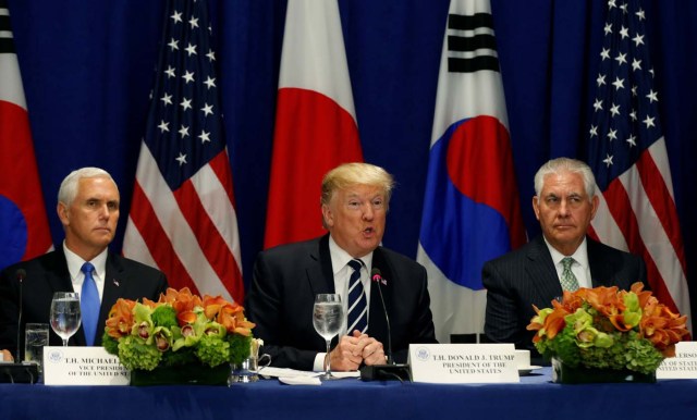 U.S. President Donald Trump, flanked by Vice President Mike Pence and Secretary of State Rex Tillerson, speaks during a meeting with South Korean president Moon Jae-in and Japanese Prime Minister Shinzo Abe during the U.N. General Assembly in New York, U.S., September 21, 2017. REUTERS/Kevin Lamarque