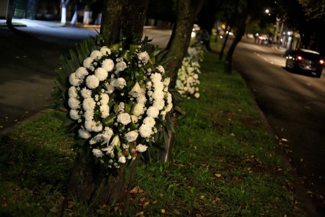 Floral wreaths for the students of the Enrique Rebsamen school are seen attached to trees, after an earthquake in Mexico City, Mexico September 22, 2017. REUTERS/Jose Luis Gonzalez