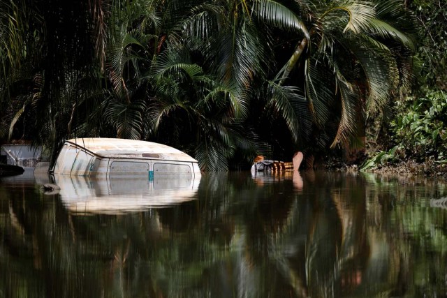 A car submerged in flood waters is seen close to the dam of the Guajataca lake after the area was hit by Hurricane Maria in Guajataca, Puerto Rico September 23, 2017. REUTERS/Carlos Garcia Rawlins TPX IMAGES OF THE DAY