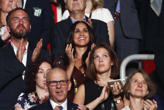Meghan Markle (center, wearing dark red), girlfriend of Britain's Prince Harry, applauds during the opening ceremony for the Invictus Games in Toronto, Canada, September 23, 2017. REUTERS/Mark Blinch