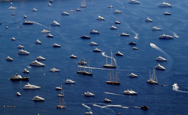 Luxury boats are seen during the Monaco Yacht show, one of the most prestigious pleasure boat show in the world, highlighting hundreds of yachts for the luxury yachting industry and welcomes 580 leading companies, in the bay of Monaco, September 27, 2017. REUTERS/Eric Gaillard