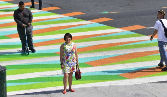 Adriana Cruz-Diez, daughter of Venezuelan-born artist Carlos Cruz-Diez who's painted crosswalks outside the Broad Museum in Los Angeles, California are a part of the Pacific Standard Time LA/LA Show, an exploration of Latino and Latin American Art in dialogue with Los Angeles poses on September 14, 2017 in Los Angeles, California. / AFP PHOTO / FREDERIC J. BROWN
