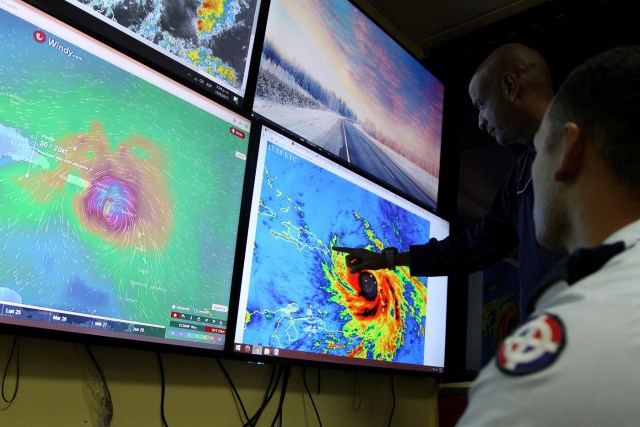 Members of the Emergency Operations Committee (COE) monitor the trajectory of Hurricane Maria in Santo Domingo, Dominican Republic, September 19, 2017.  REUTERS/Ricardo Rojas