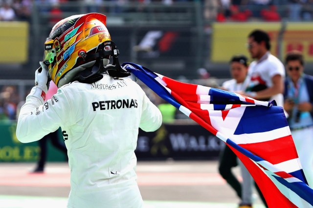 MEXICO CITY, MEXICO - OCTOBER 29: Lewis Hamilton of Great Britain and Mercedes GP celebrates after winning his fourth F1 World Drivers Championship during the Formula One Grand Prix of Mexico at Autodromo Hermanos Rodriguez on October 29, 2017 in Mexico City, Mexico. Mark Thompson/Getty Images/AFP