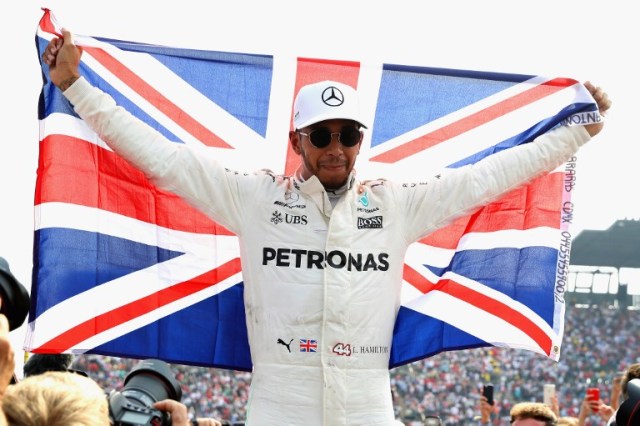 MEXICO CITY, MEXICO - OCTOBER 29: Lewis Hamilton of Great Britain and Mercedes GP celebrates after winning his fourth F1 World Drivers Championship during the Formula One Grand Prix of Mexico at Autodromo Hermanos Rodriguez on October 29, 2017 in Mexico City, Mexico. Mark Thompson/Getty Images/AFP