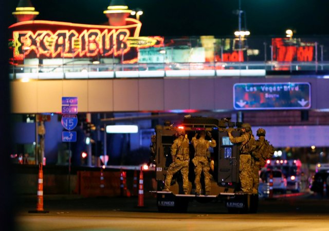 FBI agents ride an armored vehicle to a staging area on October 2, 2017, after a mass shooting during a music festival on the Las Vegas Strip in Las Vegas, Nevada, U.S. REUTERS/Las Vegas Sun/Steve Marcus