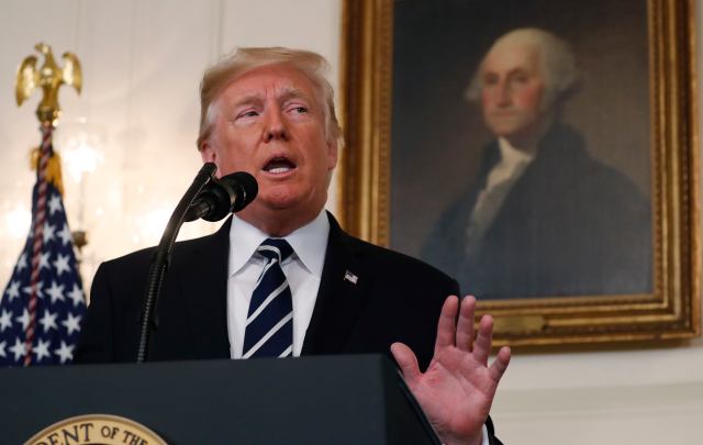 U.S. President Donald Trump makes a statement on the mass shooting in Las Vegas in front of a portrait of President George Washington in the Diplomatic Room at the White House in Washington, U.S., October 2, 2017. REUTERS/Kevin Lamarque