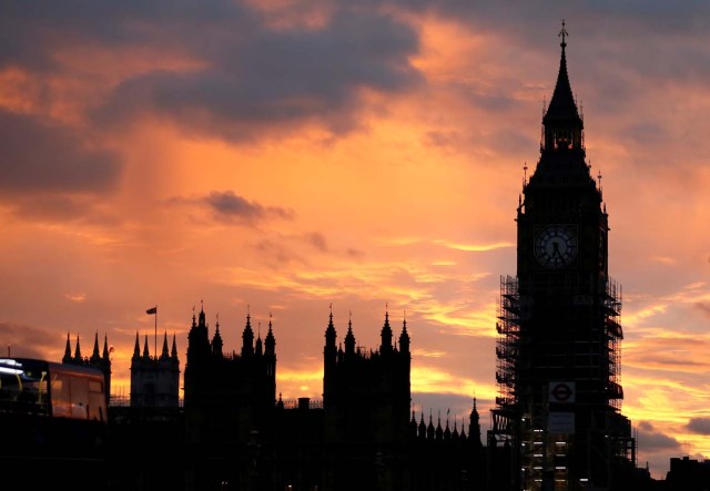 Elizabeth Tower, commonly known as Big Ben, partially covered in scaffolding during repair works on the Houses of Parliament, stands in the foreground of a sunset, in London, Britain, October 7, 2017. REUTERS/Afolabi Sotunde