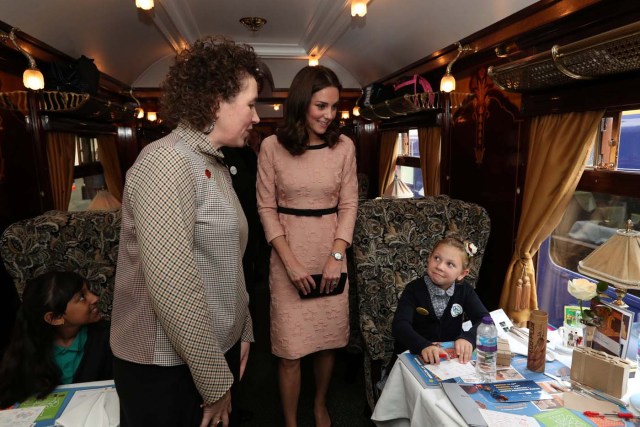 Britain's Catherine, The Duchess of Cambridge speaks to children onboard the Belmond British Pullman train at Paddington Station as she attends the Charities Forum in London, October 16, 2017. REUTERS/Jonathan Brady/Pool