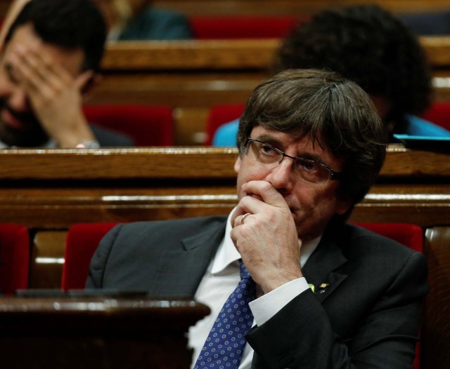 Catalan President Carles Puigdemont gestures during a plenary session at the Catalan regional Parliament in Barcelona, Spain, October 27, 2017. REUTERS/Albert Gea
