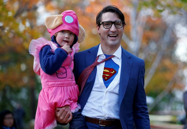 Canada's Prime Minister Justin Trudeau carries his son Hadrien while participating in Halloween festivities at Rideau Hall in Ottawa, Ontario, Canada, October 31, 2017. REUTERS/Chris Wattie     TPX IMAGES OF THE DAY