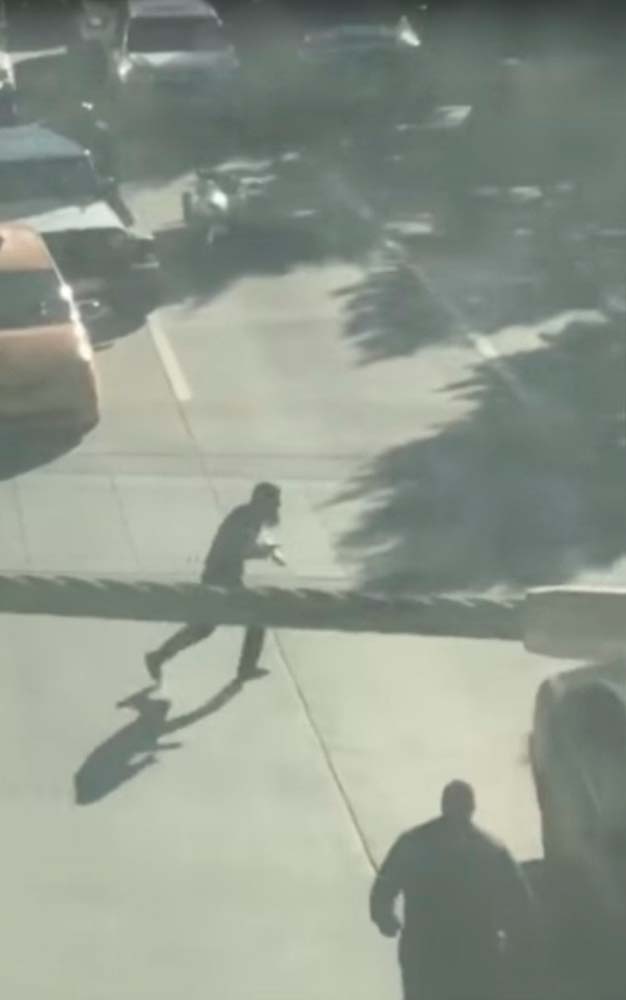 Suspected driver of the pickup truck that mowed down pedestrians and cyclists on a bike path alongside the Hudson River runs after the attack in the middle of a road, in New York City, NY, U.S., in this still image from a video obtained from social media October 31, 2017. TAWHID KABIR XISAN via REUTERS THIS IMAGE HAS BEEN SUPPLIED BY A THIRD PARTY. MANDATORY CREDIT. NO RESALES. NO ARCHIVES. MUST ON SCREEN COURTESY TAWHID KABIR XISAN