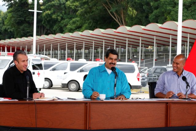 Venezuela's President Nicolas Maduro (C) speaks during an event to handover ambulances for Miranda state government, next to Venezuela's Vice President Tareck El Aissami (L) and Hector Rodriguez, governor of Miranda state, in Caracas , Venezuela November 2, 2017. Miraflores Palace/Handout via REUTERS ATTENTION EDITORS - THIS PICTURE WAS PROVIDED BY A THIRD PARTY