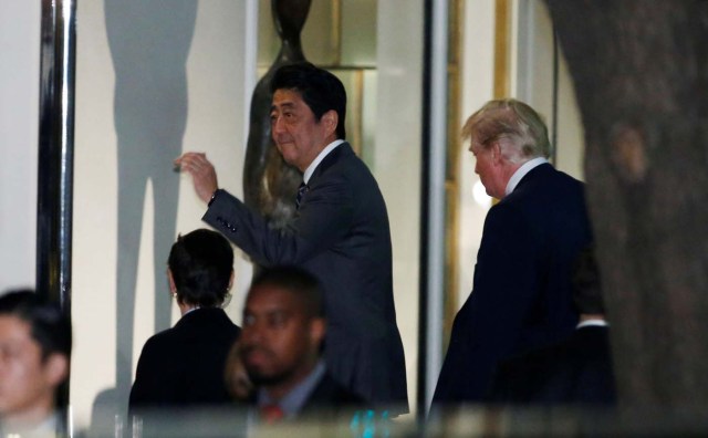 U.S. President Donald Trump (R) and Japan's Prime Minister Shinzo Abe enter a restaurant for their dinner in Tokyo, Japan, November 5, 2017. REUTERS/Toru Hanai