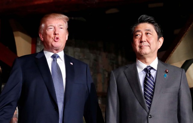 U.S. President Donald Trump (L) and Japan's Prime Minister Shinzo Abe meet for a dinner at a restaurant in Tokyo, Japan, November 5, 2017. REUTERS/Kim Kyung-Hoon