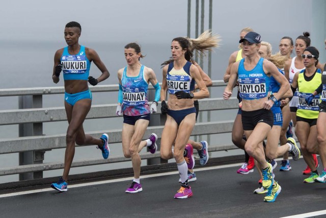 Nov 5, 2017; New York, NY, USA; Diane Nukuri (BDI) and Christelle Daunay (FRA) and Stephanie Bruce (USA) and Kellyn Taylor (USA) compete for second in the New York City marathon as they cross at the Verrazano Bridge. Mandatory Credit: Gregory J. Fisher-USA TODAY Sports