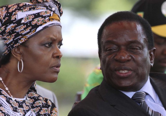 FILE PHOTO: President Robert Mugabe's wife Grace Mubage and vice-President Emmerson Mnangagwa attend a gathering of the ZANU-PF party's top decision making body, the Politburo, in the capital Harare, Zimbabwe, February 10, 2016. REUTERS/Philimon Bulawayo/File Photo