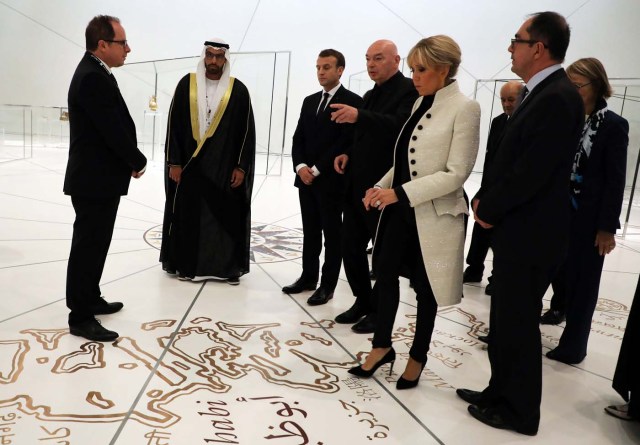 (From R-L) President-Director of the Louvre Museum, Jean-Luc Martinez, Brigitte Macron the wife of the French president, French Architect Jean Nouvel, French President Emmanuel Macron, Chairman of Abu Dhabi's Tourism and Culture Authority Mohamad Khalifa al-Mubarak visit the Louvre Abu Dhabi Museum during its inauguration in Abu Dhabi, UAE, November 8, 2017. Picture taken November 8, 2017. REUTERS/Lucovic Marin/Pool